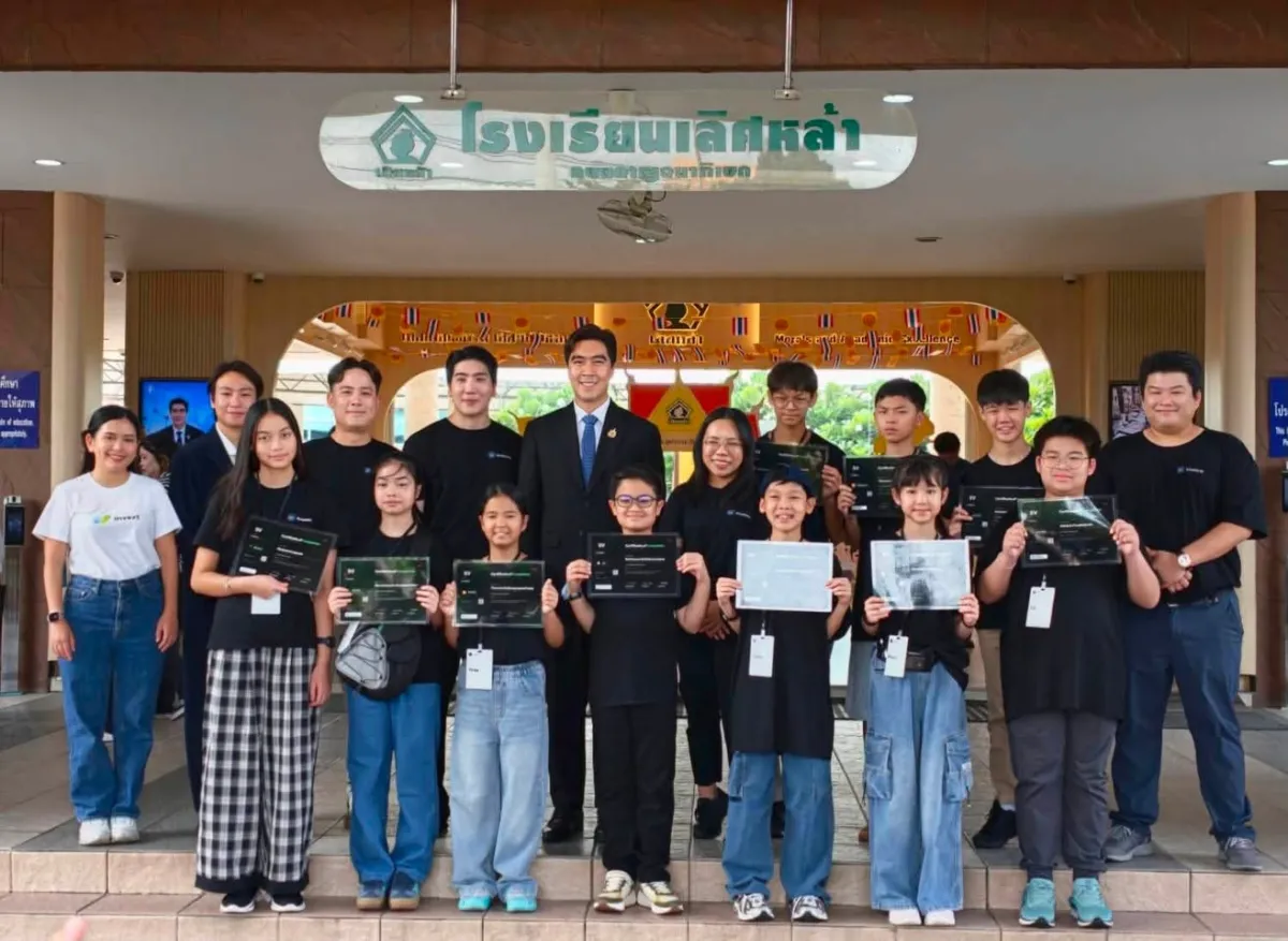 Students holding their certificates with the spokesperson and the SV Academy team at Lertlah School