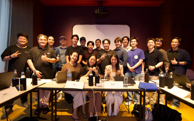 The entrepreneurs cohort group photo around the workshop table