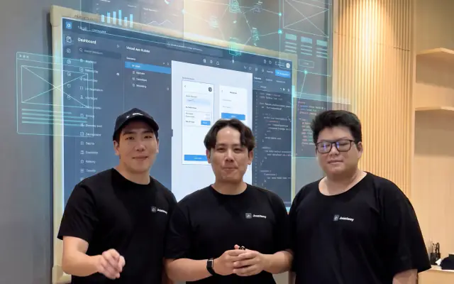 The three SV Academy founders standing together in the classroom